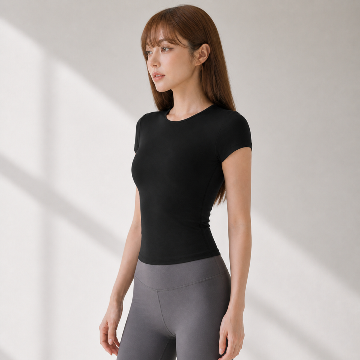 Velvet model | Contour Short-Sleeve Yoga Tee | Black | contour-short-sleeve-yoga-tee-black-side-v4-1x1.png