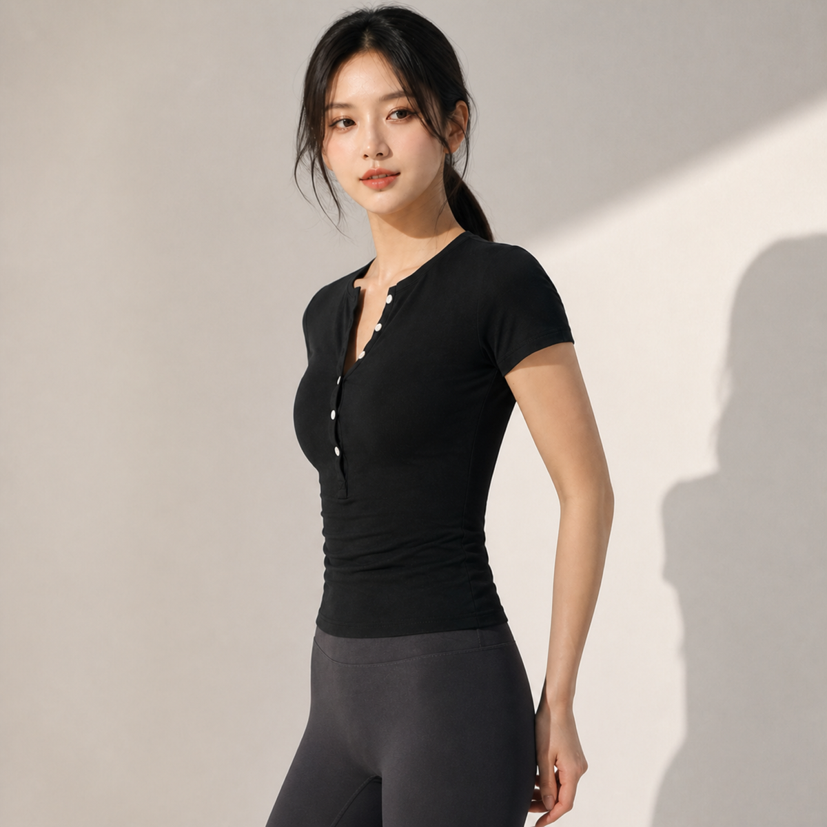 Velvet model | Henley Short-Sleeve Yoga Top | Black | henley-short-sleeve-yoga-top-black-side-v4-1x1.png