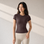 Velvet model | Seamless Short-Sleeve Yoga Tee | Brown | seamless-short-sleeve-yoga-tee-brown-front-v4-1x1.png